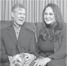  ?? LARRY MCCORMACK, THE (NASHVILLE) TENNESSEAN ?? Randy Travis, who has viral cardiomyop­athy, is fighting to regain his speech and ability to walk with wife Mary’s help.
