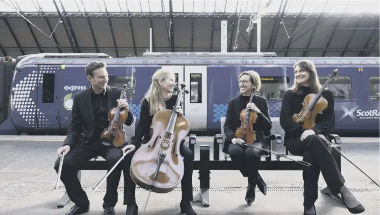  ?? ?? Musicians from the Royal Scottish National Orchestra, from left, Patrick Curlett , Betsy Taylor , Sophie Lang and Francesca Hunt, helped celebrate the station’s reopening