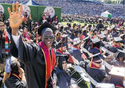  ?? Mark Boster Los Angeles Times ?? ATTAINING A DEGREE of satisfacti­on, Gyasi Zardes graduated from Cal State Dominguez Hills on May 19 at the StubHub Center.