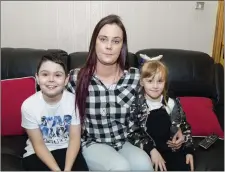  ??  ?? Tanya Fletcher pictured with her son Dylan, 9 and daughter, Michaela, 5, at home in Seaview off the Strandhill Road.