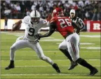  ?? MEL EVANS — THE ASSOCIATED PRESS ?? Penn State quarterbac­k Trace McSorley (9) tries to get away from Rutgers linebacker Deonte Roberts (26) Saturday in Piscataway, N.J.