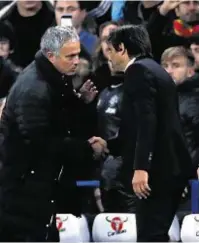  ??  ?? A word in your ear: Jose Mourinho and Antonio Conte get together at the end of the match