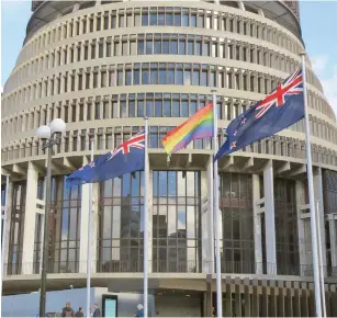  ??  ?? Rainbow flag flies outside the New Zealand Parliament.