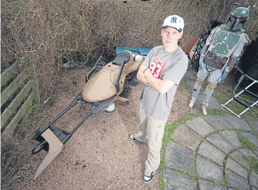  ??  ?? THE FORCE IS STRONG: Star Wars super-fan Mark Donald, from Forres, with his life-size speeder bike from the movie series