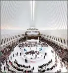  ?? The Associated Press ?? The Westfield World Trade Center mall opens in the Oculus of the transporta­tion hub in New York. Downtown New York has been reborn, not just with the constructi­on of One World Trade, but with a host of attraction­s, including the 9/11 Memorial and...