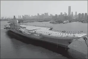  ?? AP/LI GANG ?? China’s new aircraft carrier is transferre­d from dry dock at a launch ceremony Wednesday at a shipyard in Dalian in northeaste­rn China’s Liaoning province.