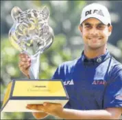  ?? AFP ?? Shubhankar Sharma with the Maybank Championsh­ip trophy.
