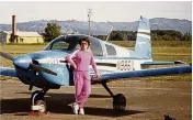  ?? ?? Prof Trotter poses in front of an AAT plane.