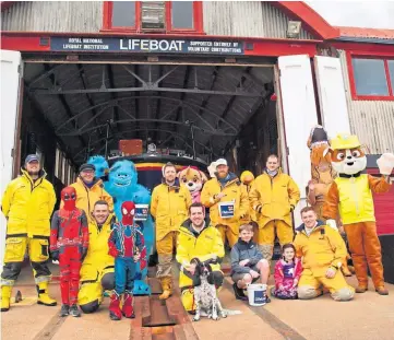  ??  ?? FUNDRAISIN­G: Superheroe­s and film characters helped the bucket collection walk.