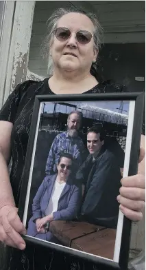  ?? STEVE BOSCH/VANCOUVER SUN ?? Elouise Lord, mother of convicted killer Derik Lord, holds a picture of herself, her husband Dave and Derik, right. She insists her son is innocent. “Why would we have any doubt?” she asks.