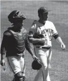  ?? MARK HOFFMAN / MILWAUKEE JOURNAL SENTINEL ?? Brandon Woodruff, with catcher Omar Narváez, picked up in exhibition play where he left off when spring training was cut short.