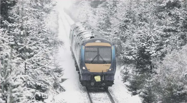  ??  ?? 0 Heavy snow near Inverness failed to halt Scotrail services yesterday but many areas suffered once more as winter returned