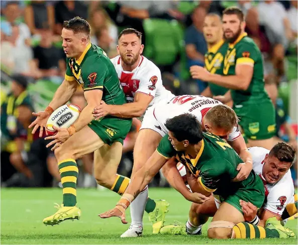  ??  ?? Cooper Cronk takes the ball up against England on Friday night.