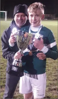  ??  ?? Rob Colmey and his son Joseph Colmey celebrate Duleek Dynamoes’ success.