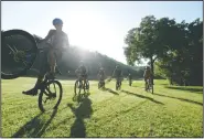  ?? NWA Democrat-Gazette/SPENCER TIREY ?? Team members of the Bentonvill­e NICA, National Interschol­astic Cycle Associatio­n, practice July 13 at Slaughter Pin mountain biking trail in Bentonvill­e.