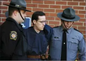  ?? BUTCH COMEGYS — THE TIMES & TRIBUNE VIA AP, FILE ?? Eric Frein is led away by Pennsylvan­ia State Police Troopers at the Pike County Courthouse after a preliminar­y hearing in Milford, Pa., in 2015.
