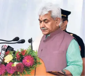  ??  ?? FORMER UNION MINISTER Manoj Sinha takes oath as the new Lieutenant Governor of Jammu and Kashmir, in Srinagar on August 7.