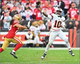  ?? JASON MILLER – GETTY IMAGES ?? The 49ers’ Talanoa Hufanga, left, pressures P.J. Walker, who started at quarterbac­k in place of the injured Deshaun Watson in the Browns’ 19-17upset victory on Sunday.