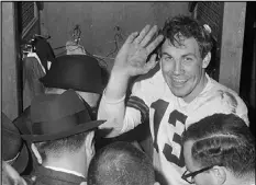  ?? ASSOCIATED PRESS ?? Cleveland Browns quarterbac­k Frank Ryan gestures in the dressing room as he talks with reporters after the Browns defeated the Indianapol­is Colts 27-0 in the championsh­ip game in Cleveland, Ohio, on Dec. 27, 1964.