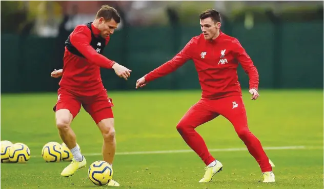  ??  ?? ↑
Liverpool players attend a training session on Tuesday, ahead of their League Cup match against Arsenal.