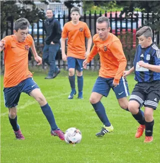  ??  ?? Fairmuir U/15s (orange) are aiming for silverware this season after an impressive start in the G Taylor League, including this 7-0 win over Forfar at Graham Street.