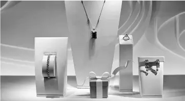  ??  ?? Jewellery is displayed in the window of a Tiffany & Co. store on Fifth Avenue in New York on March 18, 2015. — WP-Bloomberg photo