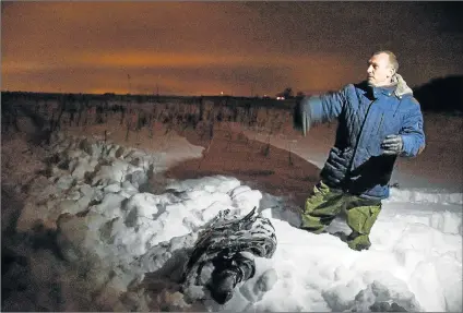  ?? Picture: AFP ?? CRASH SITE: A man shows debris at the site of plane crash that killed 71 passengers in Ramensky district, near Moscow at the weekend