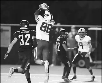  ??  ?? Moapa Valley Pirates’ Justin Proffitt (88) pulls in a reception before runs into the end zone for a touchdown March 19.