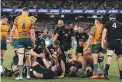  ?? PHOTOSPORT ?? The All Blacks celebrate a try against the Wallabies at the MCG last year. The test is a big revenue-raiser for Rugby Australia.