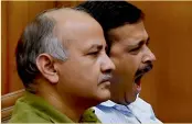  ??  ?? Delhi chief minister Arvind Kejriwal ( right) and his deputy Manish Sisodia during the special session of the Delhi Assembly on Tuesday. —