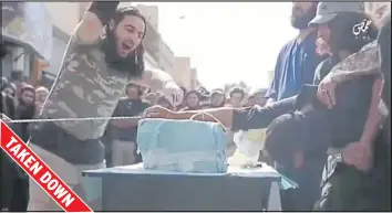  ??  ?? Footage shows an IS thug in the act of cutting off a man’s hand. It was only removed by Facebook after the Daily Express had alerted the tech giant