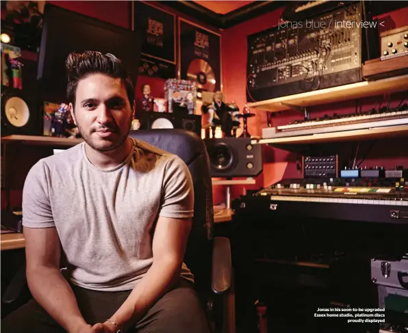  ??  ?? Jonas in his soon-to-be upgraded Essex home studio, platinum discs proudly displayed