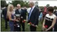  ?? EVAN VUCCI - ASSOCIATED PRESS ?? Brittany Jacobs, left, and her 6-yearold son, Christian, meet President Donald Trump and Vice President Mike Pence in Arlington National Cemetery on Monday in Arlington, Va. Christian’s father, Marine Sgt. Christophe­r Jacobs, was killed in 2011.