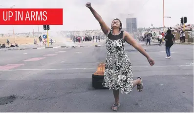  ?? Picture: Nigel Sibanda ?? Pennyville residents protest after two people from Noordgesig in Soweto were allegedly killed in a mob justice attack for stealing. New Canada and Main Reef roads were closed off to motorists.