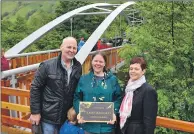  ?? Photograph Iain Ferguson, The Write Image. ?? Husband of the late Karen Haggerty, Iain, with daughters Deborah and Dawn with the plaque dedicating the new bridge in her name.