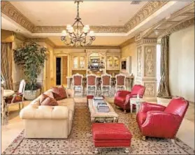  ??  ?? CUSTOM furniture, chandelier­s and drapes adorn the interior.