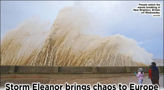  ??  ?? People watch the waves breaking in New Brighton, Britain on Wednesday. REUTERS