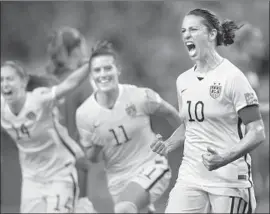  ?? Ryan Remiorz Associated Press ?? CARLI LLOYD CELEBRATES after making a penalty kick in the World Cup semifinals in 2015. She then had a hat trick in the final victory over Japan.