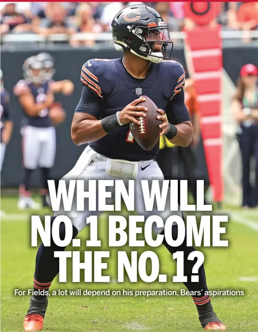  ?? JONATHAN DANIEL/GETTY IMAGES ?? Bears rookie Justin Fields (above) has fans clamoring for him to start at quarterbac­k over veteran Andy Dalton.