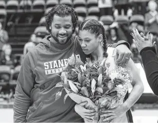  ?? Cody Glenn / Getty Images ?? Seahawks quarterbac­k Russell Wilson called younger sister Anna “a winner by nature” as the Stanford star prepares for her Final Four game against Arizona on Friday.