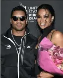  ?? Associated Press ?? Russell Wilson, left, and wife Ciara at the Sports Illustrate­d Swimsuit party last month in New York.