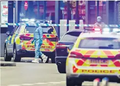  ??  ?? Police in Streatham High Road and, left, a woman near the scene of the attacks