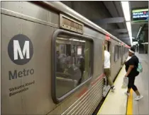  ?? DAVID CRANE – STAFF PHOTOGRAPH­ER ?? Riders board the Red Line at Union Station. Amid safety concerns, L.A. Metro ridership still is well down from pre-pandemic levels.