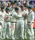  ?? ?? Scott Boland celebrates the fall of Jack Leach with his teammates