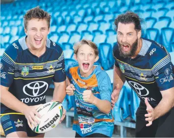  ??  ?? TRUE FANS: Northern Pride strength and conditioni­ng coach Jonnie Walker with his sons Taj, 16, and Jett, 11, are mad Cowboys and JT fans cheering on their hero. Picture: STEWART McLEAN