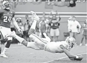  ??  ?? Clemson quarterbac­k Kelly Bryant dives for a touchdown. He has had ups and downs during his first season as the starter.
ROB KINNAN/USA TODAY SPORTS