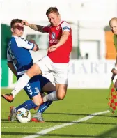  ??  ?? Daniel Kearns is challenged by Dean Clarke. Pic: Conor Wyse.