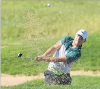  ?? JASON MALLOY/THE GUARDIAN ?? Stratford’s Jason Poley hits out of the sand Thursday during the Canada Games golf championsh­ip.