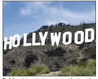  ??  ?? The Hollywood sign, which sits near the top of Beachwood Canyon, is adjacent to Griffith Park in the Hollywood Hills of Los Angeles. It’s now in the middle of a trademark dispute.
(AP Photo/Reed Saxon, File)