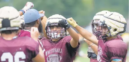  ?? RICK KINTZEL/THE MORNING CALL ?? Whitehall football players gather around first-year coach Matt Senneca on Tuesday during a practice session.